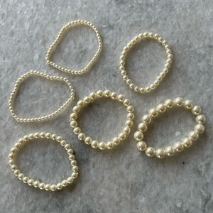 Set of 6 pearl faux bracelets (one size fits most). Slip on bracelets